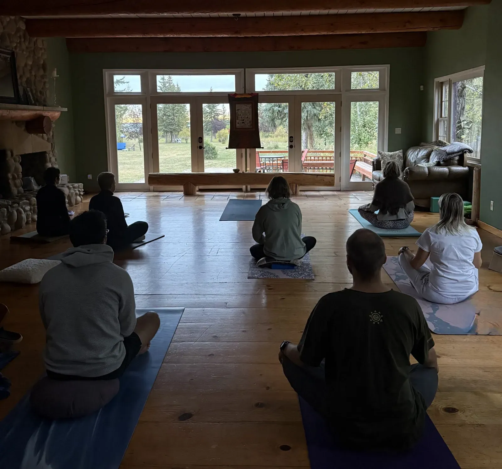 3 day silent meditation retreat in Alberta: participants meditating in the practice room of the lake house at Gull Lake