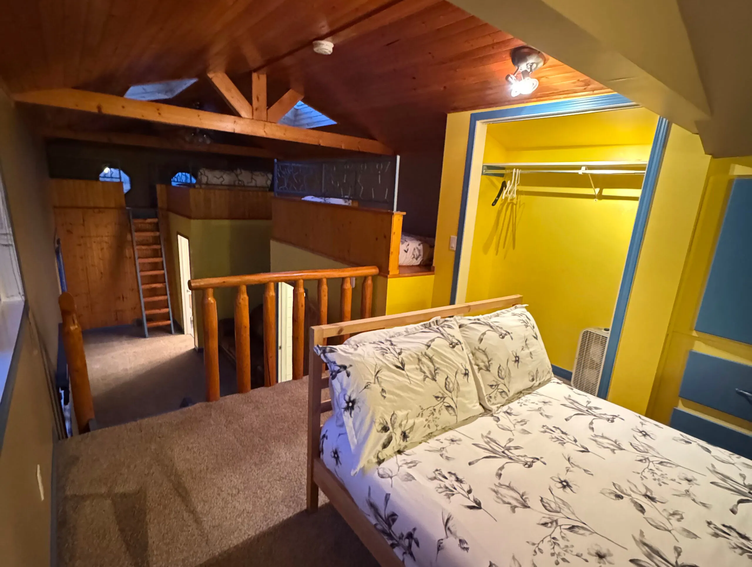 Shared women’s room with beds on two levels in the lake house at Gull Lake