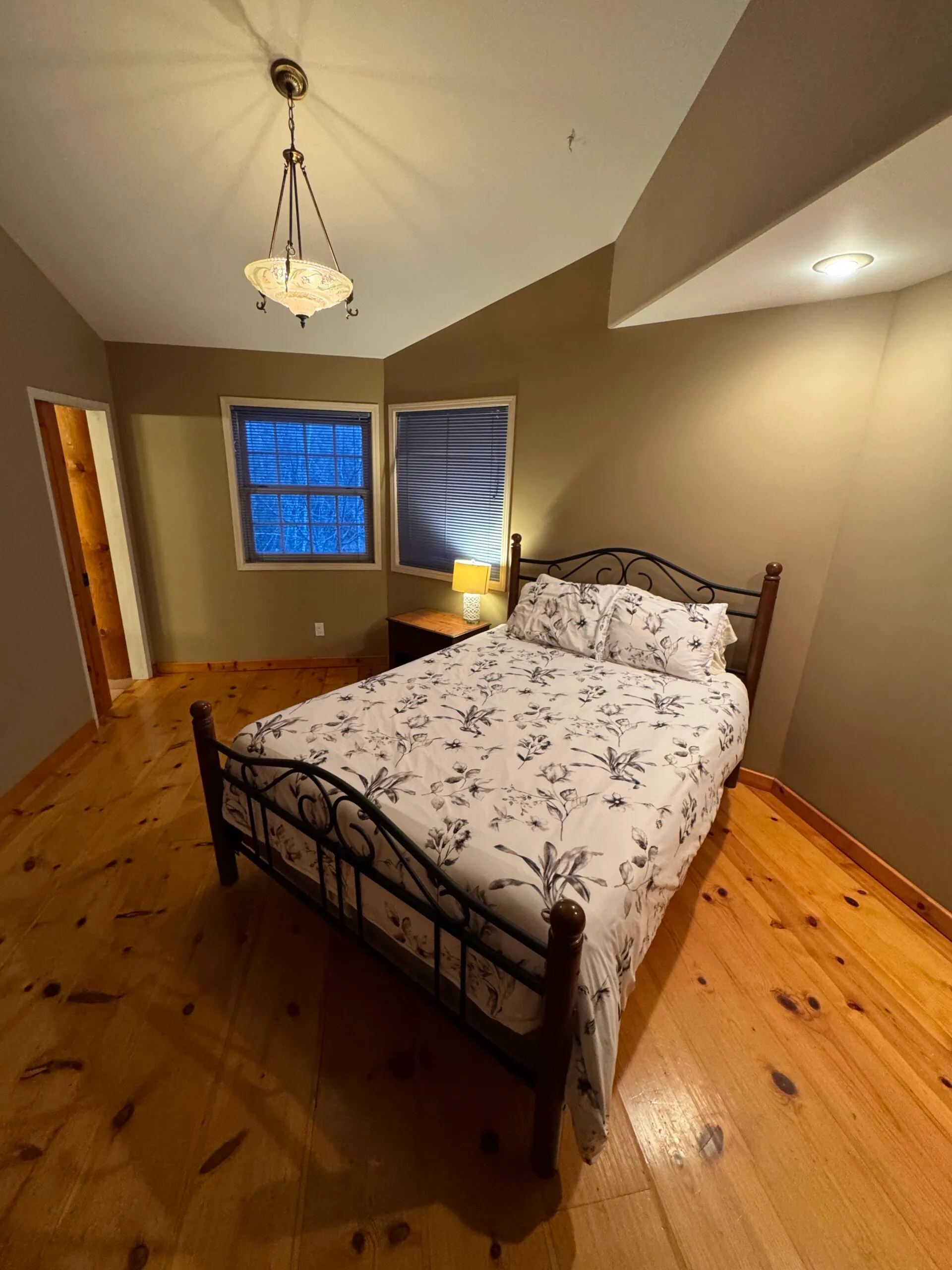 Private room with a double bed in the lake house at Gull Lake